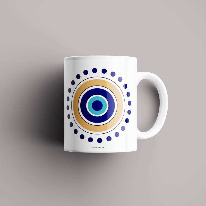 Evil Eye Dots Mug – "Modern evil eye ceramic mug with circular dot patterns, stylishly crafted for protection, positivity, and everyday use."